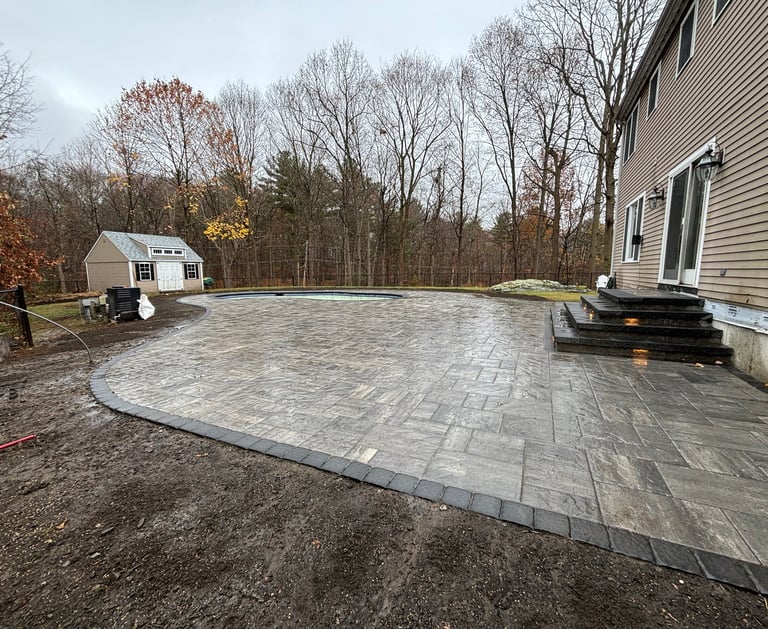 outdoor patio surrounding pool area