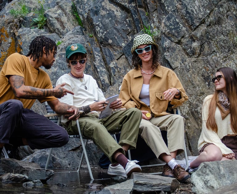 A group of friends talking outside while wearing eco-conscious sunwear