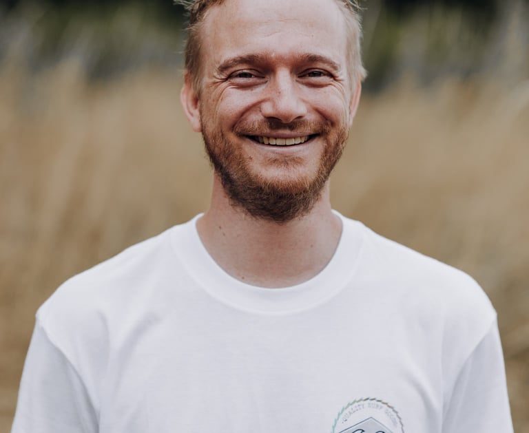 a man with a beard and a beard, smiling