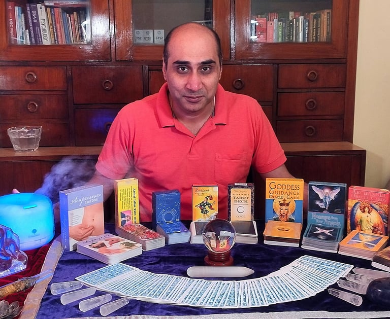 Dr. Prabal with Tarot, Oracle cards & crystals for spiritual guidance.