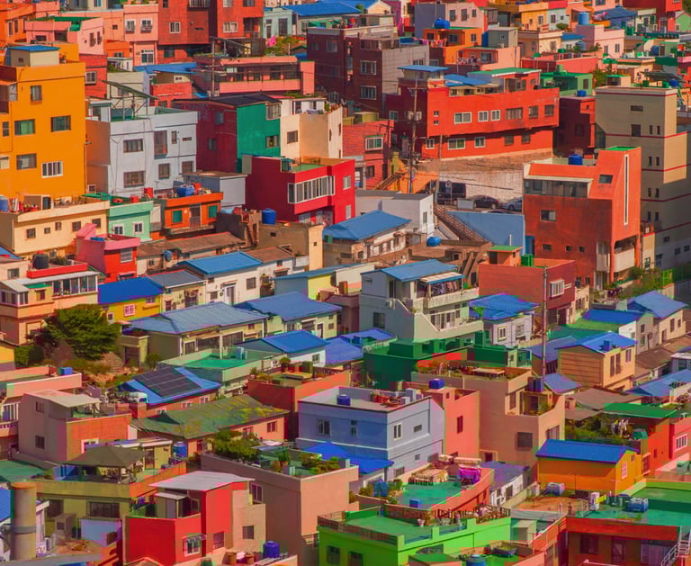 wallpaper - a large city with many colorful buildings and a clock tower