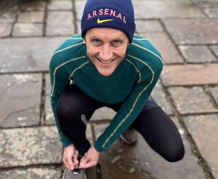 Marcus lacing up running shoes