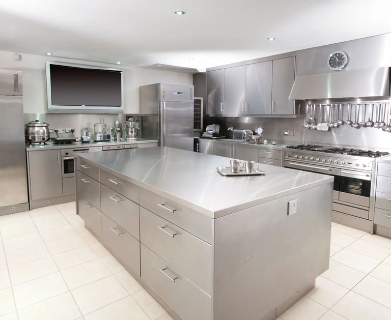 Premium stainless steel home kitchen with custom island and cabinetry, available for a custom quote.