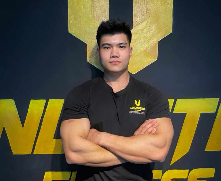 a man in a black shirt and tan pants