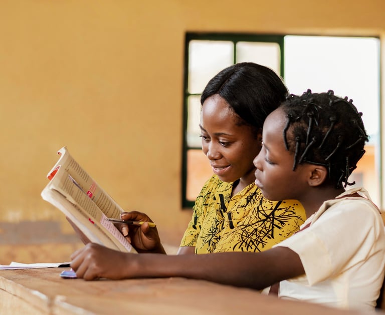 A teacher helping a child in class
