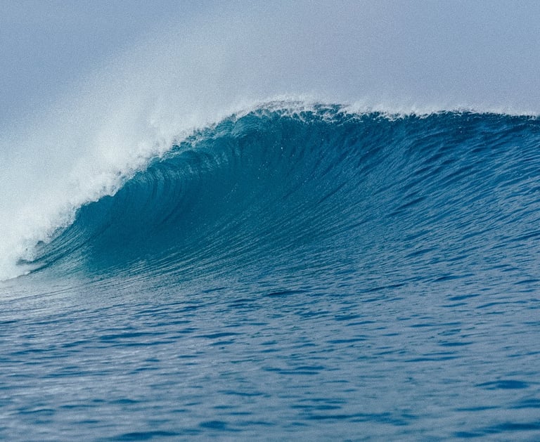 Powerful turquoise wave breaking at Telescopes in Mentawai Islands, perfect for surfing adventures.