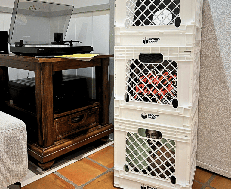 three vinyl record storage crates in white with a record player