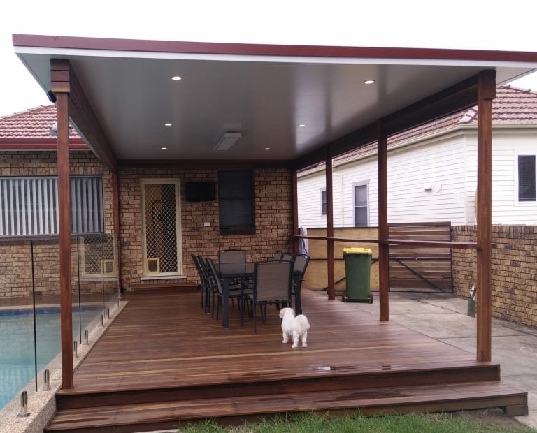 Insulated panel roof over a spotted gum deck