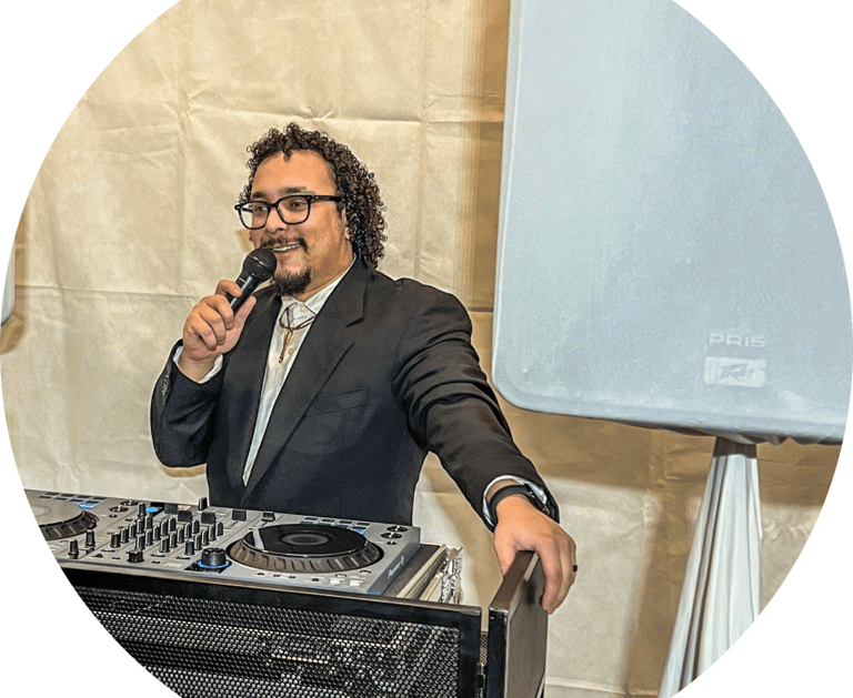 a man in a suit and tie is holding a microphone