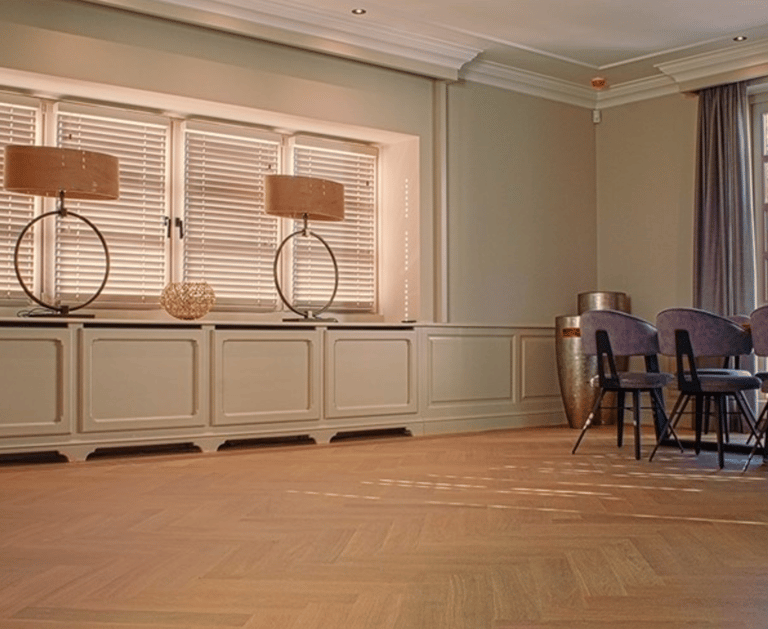 a room with a table and chairs and a table