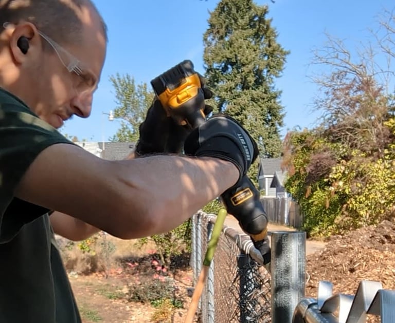 Cyd installing a fence gate