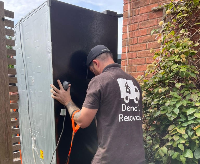 deanos removals worker removing fridge from a worcester home