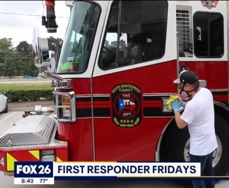 Technician cleaning fire truck