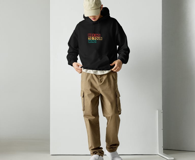 a man in a black hoodie and a hat