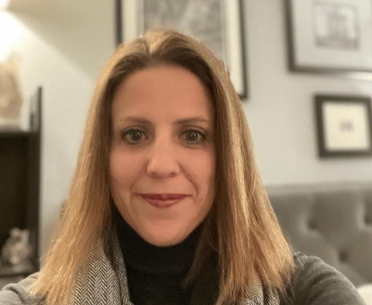 Amy McArdle in a black turtle neck sweater