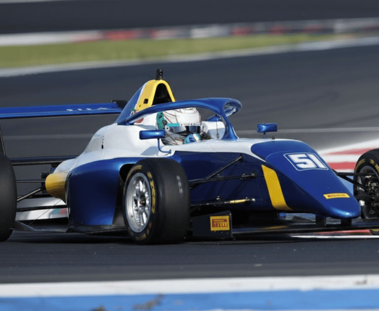 a blue and white formula 4 racing car
