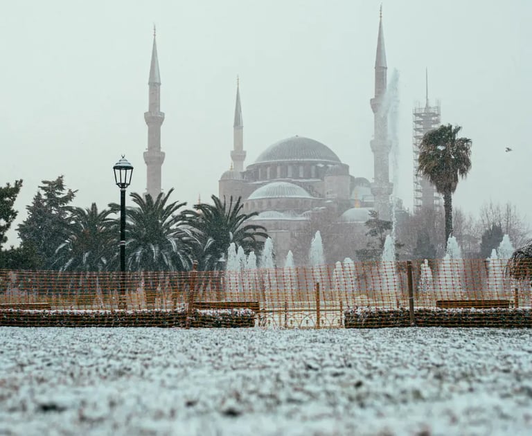 View of snow-covered Hagia Sophia and Sultanahmet Square during winter in Istanbul.