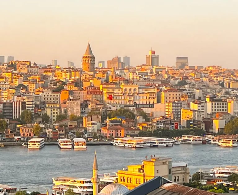View from a boutique hotel balcony overlooking the Bosphorus at sunrise in winter.