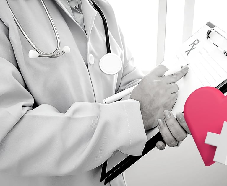 a doctor holding a heart shaped piece of paper