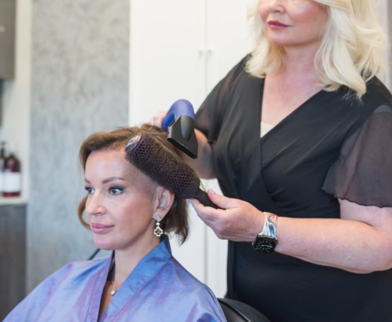 Anna in her salon with client