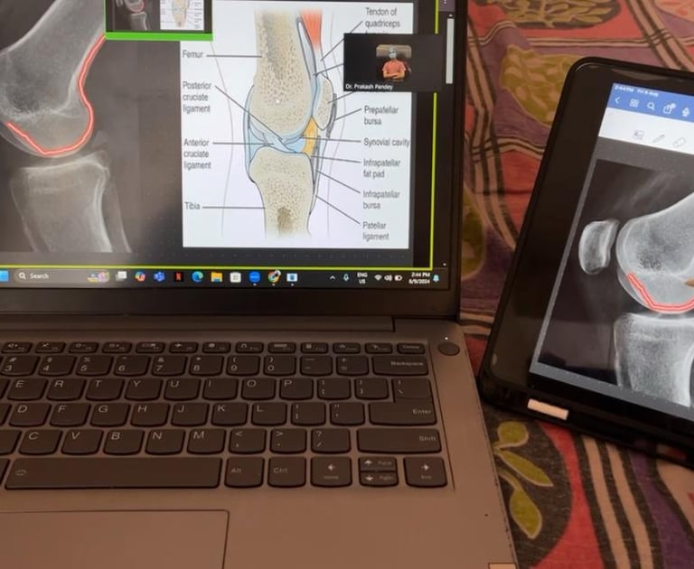 Physiotherapy educator marking X-rays on a ipad during an online teaching session.