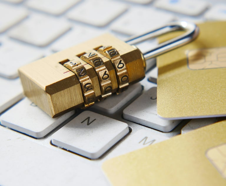 a padlocked and a credit card on keyboard
