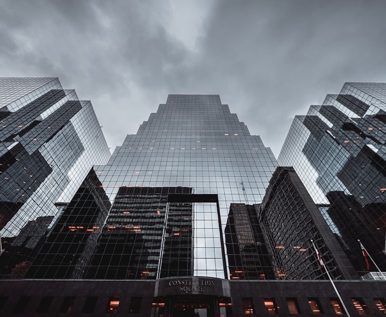a city street scene with a tall building in the background