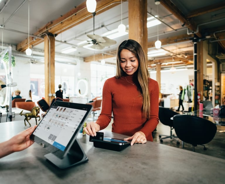 a woman is standing in front of a counter top