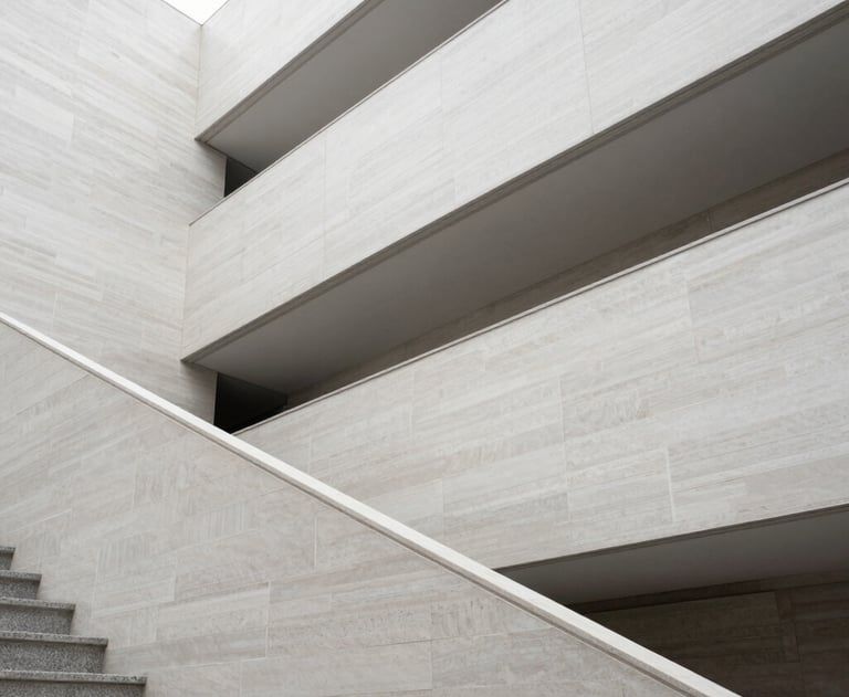 Abstract photography of modern architectural lines in an international museum setting. Light grey and off-white textures with high-key lighting.
