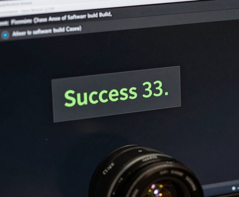 Close-up of a computer screen showing a terminal with a 'Success' message in green, representing the final stage of a software build.
