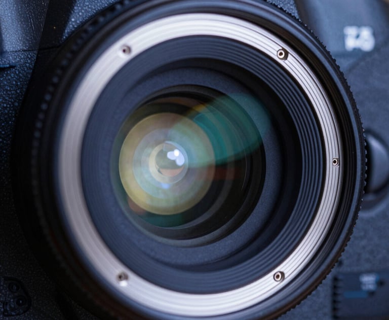 A close-up of a high-resolution professional camera sensor. The lighting is precise, highlighting the technical sophistication in dark blue and pearl white.