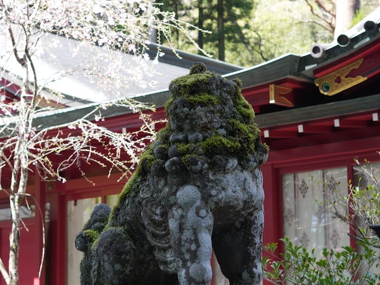 a statue of a lion in Hakone Shrine