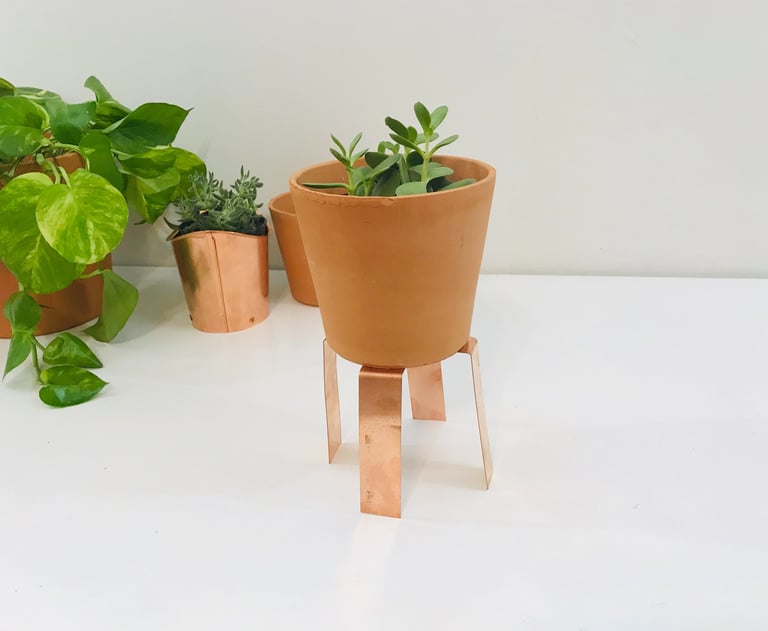 Decorative copper sculpture showcasing natural patina finish