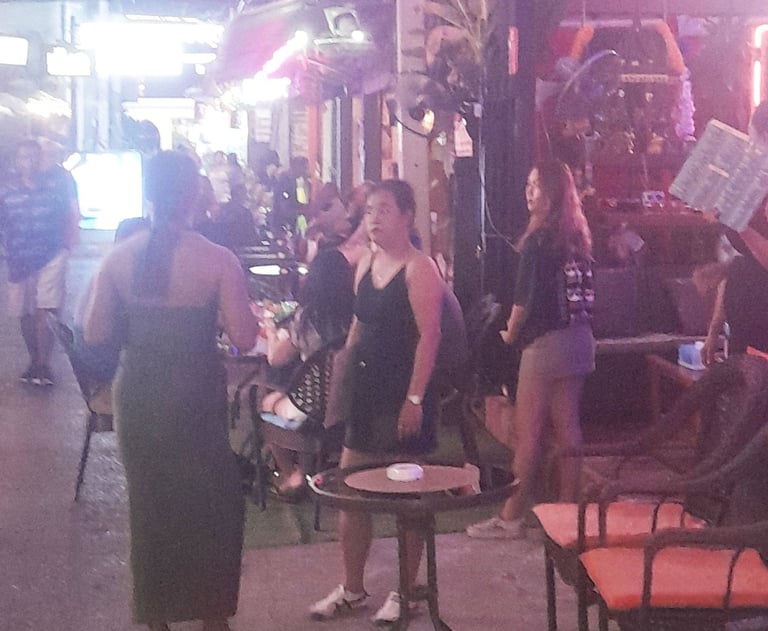 Thai women outside bar on Soi Bintabaht, Hua Hin in Thailand