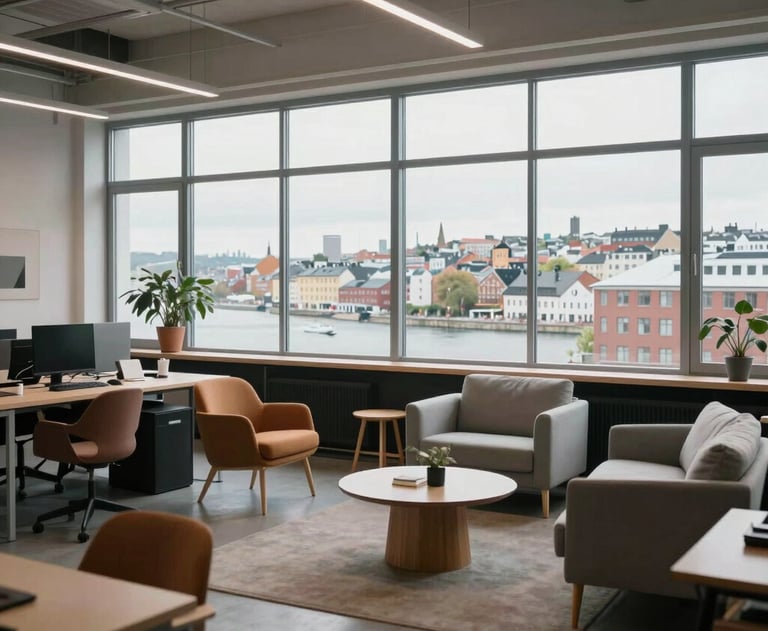 A wide shot of a modern, open-plan agency studio with Scandinavian furniture and large windows overlooking a Northern European / North American city.