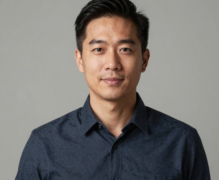 Professional headshot of a team member in a minimalist North American / US studio setting. Natural, flattering light and a neutral professional background.