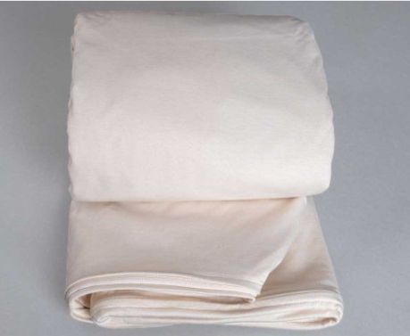 White zippered organic cotton waterproof mattress encasement by Sleep and Beyond.