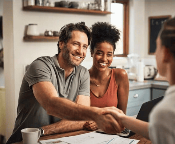 Caring professional meeting a couple in their home — representing trust, calm, and meaningful income