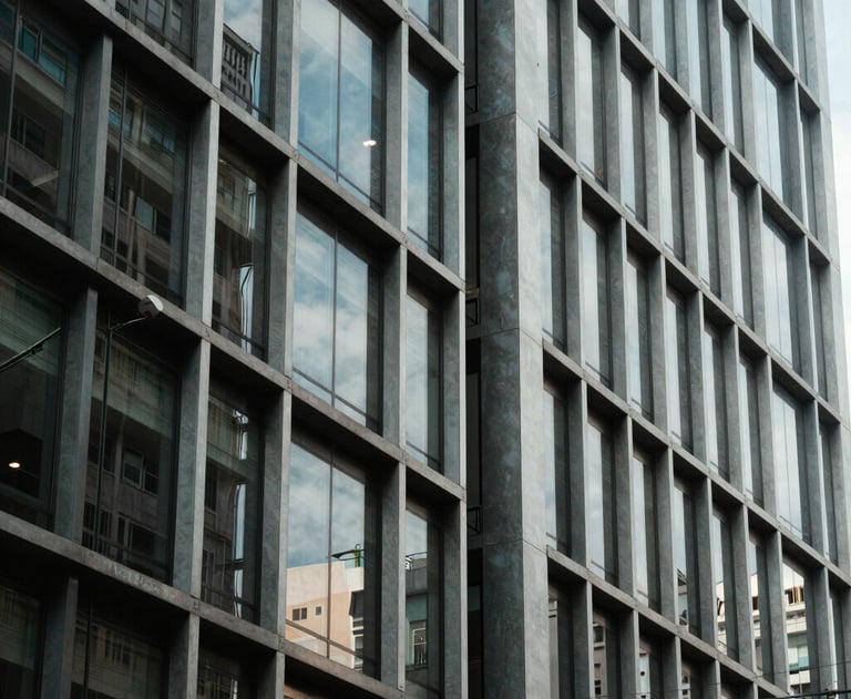 A beautiful abstract architectural photography of a modern building facade in a South American business district. Glass, steel, and symmetry. Professional vibe.