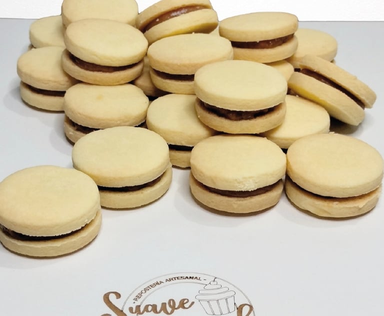 a bunch of cookies and a cupcake on a table