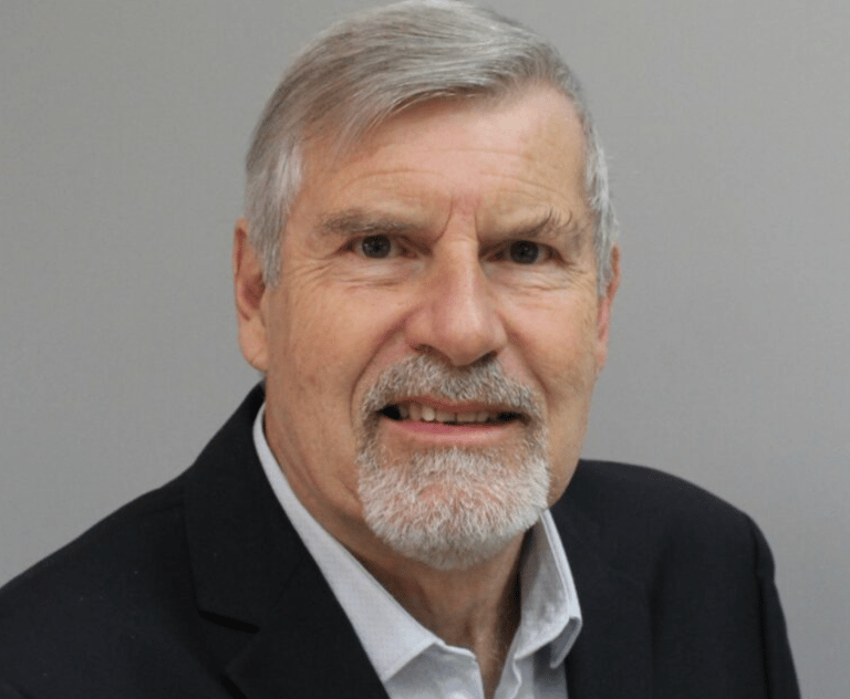 a man with a beard and a white shirt