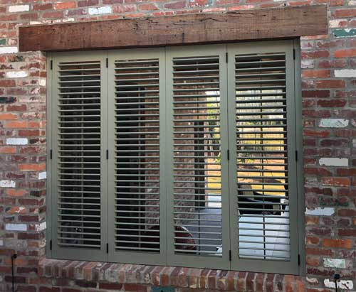 operable louver shutters with the louvers open to let light in