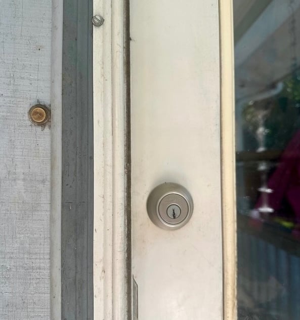 White door with deadbolt representing residential locksmith services in Canton, NC