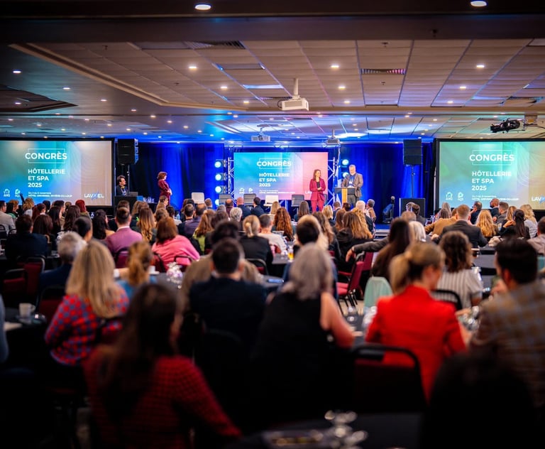 A speaker addresses a large audience at the 2025 Congress for Hospitality and Spa industries.