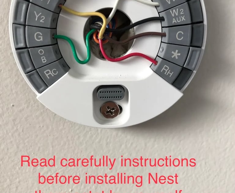 Nest Thermostat Installation photo with message in red to read instructions before installing thermostat by yourself