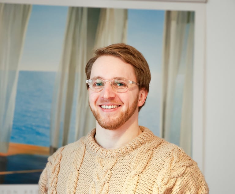 Coach Tilman headshot smiling