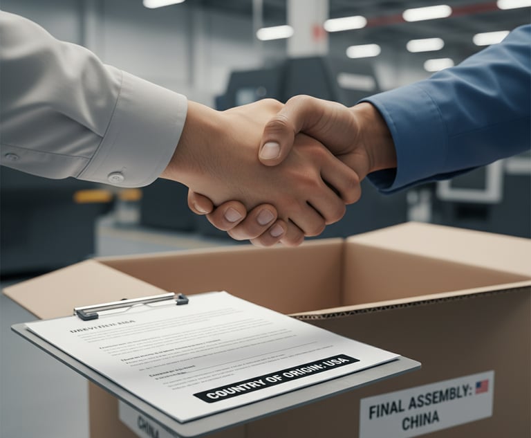 Close-up of two people shaking hands over a clipboard with documents, with a product box in the back