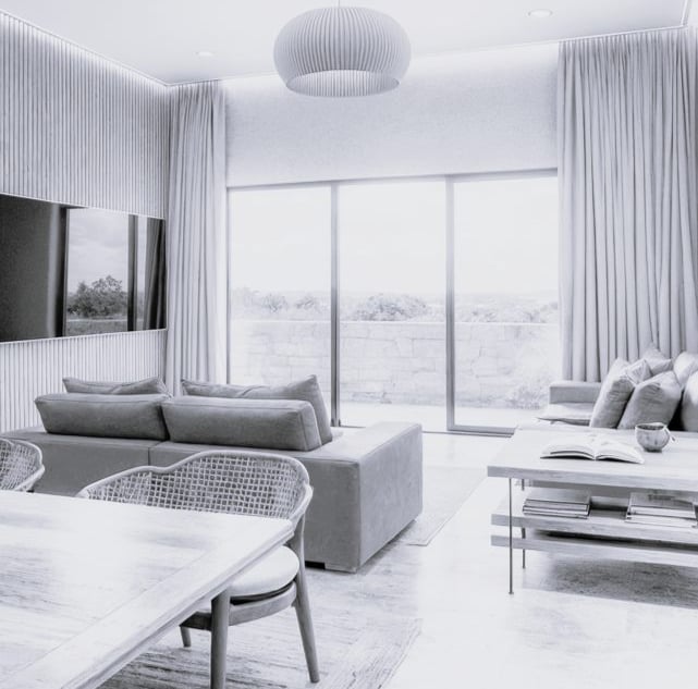 Sala de estar de proyecto residencial diseñado por CHB Arquitectura en La Paz, BCS, con acabados con