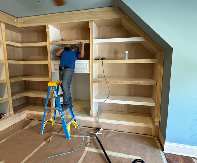 Professional carpenter working on a custom closet wall unit- Britto's Home Improvement