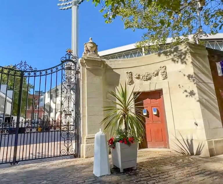 a gated entrance to a building with a gated entrance